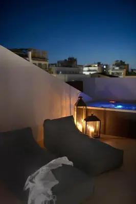 a room with a bed and a lamp on a roof at Luxury Athens Apartment 2 Bedrooms Apartment Mavis Spacious in Athens