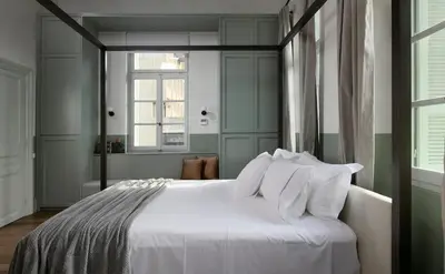 a bedroom with a bed with white sheets and pillows at Luxury Athens Apartment 2 Bedrooms Apartment Mavis Spacious in Athens