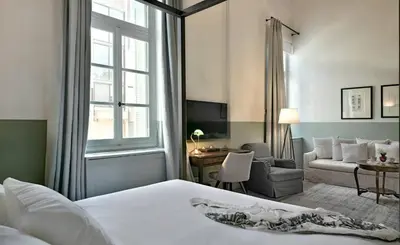 a hotel room with a bed and a living room at Amazing Athens Apartment 1 Bedroom Apartment Elfman Athinaidos in Athens
