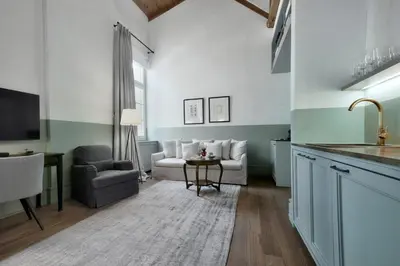 a kitchen and living room with a couch and a table at Amazing Athens Apartment 1 Bedroom Apartment Elfman Athinaidos in Athens