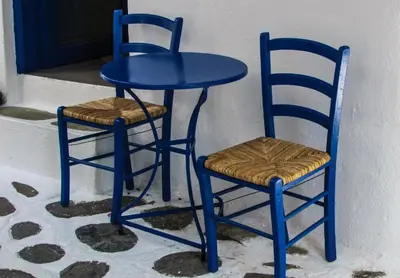 a blue table and two chairs next to a door at Stunning Athens Apartment 1 Bedroom Apartment Juvia Athinaidos in Athens