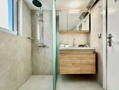 a bathroom with a shower and a sink at Elaia Luxury Selection Amber in Athens
