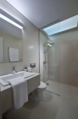 a bathroom with a sink and a toilet and a shower at Delightful Athens Villa 1 Bedroom Villa Toshiro Thissio View in Athens