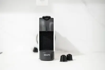 a black shaver sitting on a white background at Sunlit Serenity Cozy 1bdrm Escape in Athens in Athens