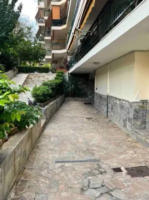 a walkway next to a building with a building at Fresh Spicy 1bd Amusement Arcade in Athens