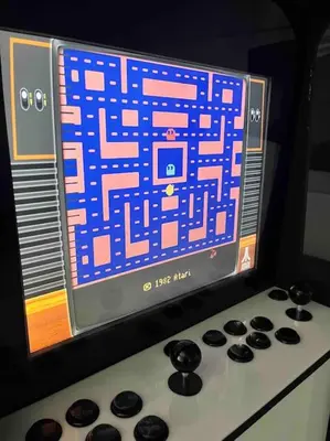 a video game screen on top of a stove at Fresh Spicy 1bd Amusement Arcade in Athens