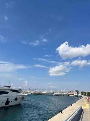 a boat is docked at a dock in the water at Fresh Spicy 1bd Amusement Arcade in Athens