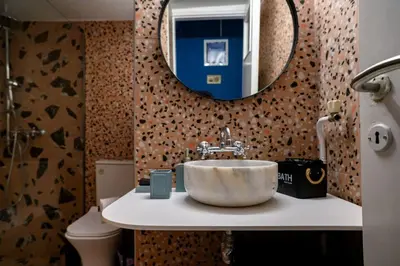 a bathroom with a sink and a mirror at BlueXenia 1 bedroom Retro Luxury in Athens