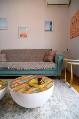 a living room with a couch and a coffee table at BlueXenia 1 bedroom Retro Luxury in Athens