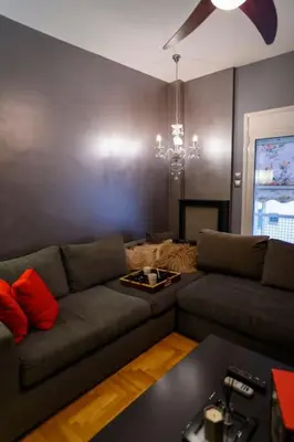 a living room with a couch and a table at Metropolitan prestigious 2 bedroom luxury in Athens