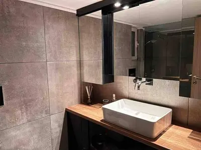 a bathroom with a white sink and a mirror at Metropolitan prestigious 2 bedroom luxury in Athens
