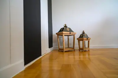 two lanterns sitting on top of a wooden floor at Seaview Orchid 2 bed Elegance in Athens