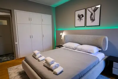 a bedroom with a bed with towels on it at Subtle 3 bed Luxury with a View in Athens