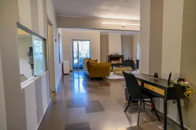 a living room with a table and a couch at Subtle 3 bed Luxury with a View in Athens