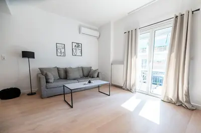 a living room with a couch and a table at Elegant 3BR apartment in the heart of Athens (Form_19) in Athens