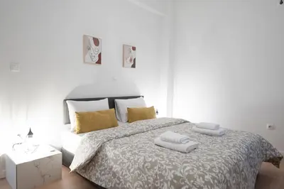 a bedroom with a bed with two towels on it at Elegant 3BR apartment in the heart of Athens (Form_19) in Athens