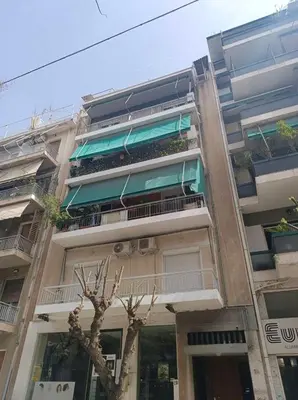 an apartment building with a tree in front of it at Elegant 3BR apartment in the heart of Athens (Form_19) in Athens