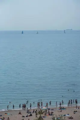 a group of people on a beach in the water at Breathtaking seaview studio in Athenian Riviera in Athens