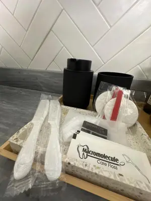 a cutting board with two plastic forks and a box at Athenian Coastal Urban Living in Athens