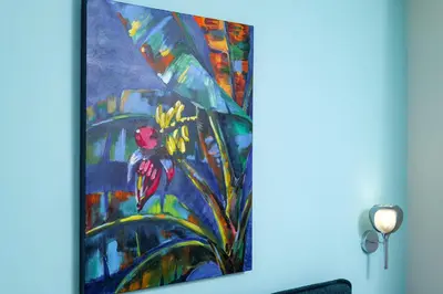 a painting of a parrot in a plant at Peaceful Private Bungalow VIPGreece in Athens