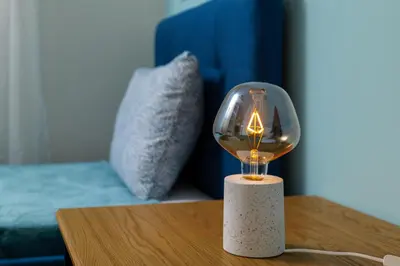 a glass lamp sitting on top of a table at Peaceful Private Bungalow VIPGreece in Athens