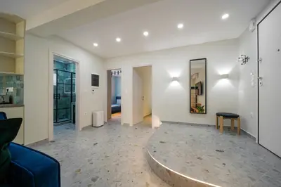 a living room with a couch and a table at Peaceful Private Bungalow VIPGreece in Athens