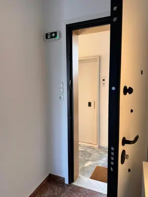 a door with a mirror in a room at Seashore Happiness Apartments in Porto Rafti