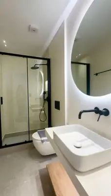 a bathroom with a sink and a toilet and a mirror at BlueMotion - PortHub Α1 in Piraeus