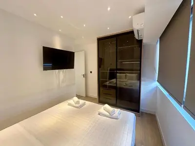 a bedroom with two white towels on a bed at BlueMotion - PortHub Α1 in Piraeus
