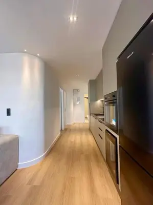 a large living room with a large flat screen tv at BlueMotion - PortHub Α1 in Piraeus