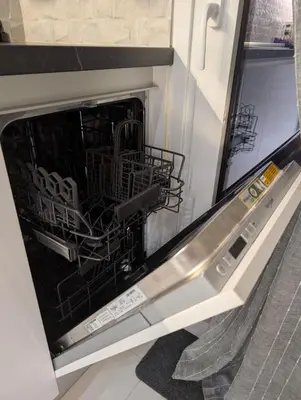 a dishwasher with a dish rack inside of it at Luxury & Spacious Apartment in Athens in Athens