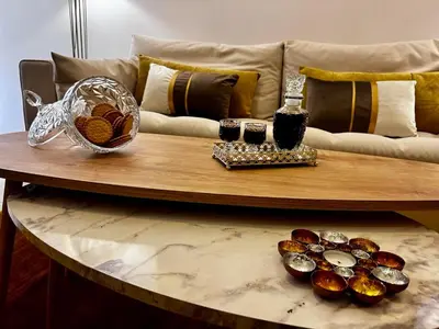 a coffee table with food and drinks on a couch at House Of Joy in Athens