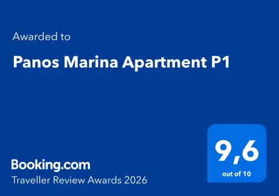 a blue sign with the words panos marina appointment pt at Panos Marina Apartment P1 in Porto Rafti