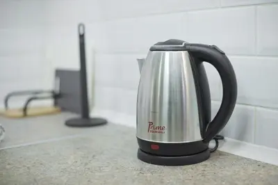 a tea kettle is sitting on a kitchen counter at Irida Stylish, Cozy, Fully Equipped Apt in Piraeus