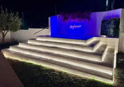 a set of stairs lit up at night at Airfenos - Athens Riviera in Anavissos