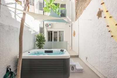a jacuzzi tub in the courtyard of a house at Kastela's Harbor Retreat with Jacuzzi in Piraeus