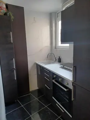 a small kitchen with a sink and a window at CozyStation in Athens