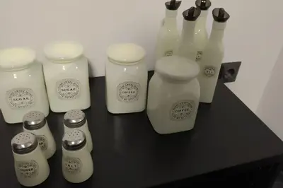 a group of white bottles sitting on a table at CozyStation in Athens