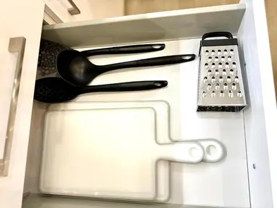 a drawer filled with cooking utensils at Victoria Secret Suite greendom in Athens
