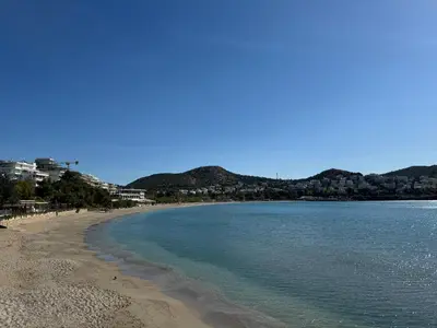 a view of a beach with mountains in the background at EMERALD LAKE RESIDENCE in Athens