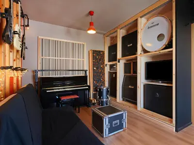 a living room with a couch and a piano at Acropolis Music Studio Loft in Athens