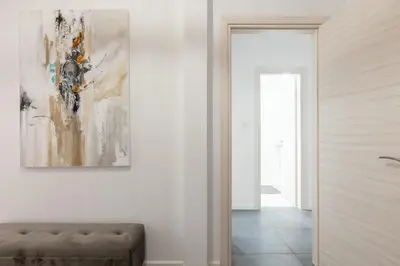a hallway with a couch and a painting on the wall at Hidden Treasure of Koukaki in Athens