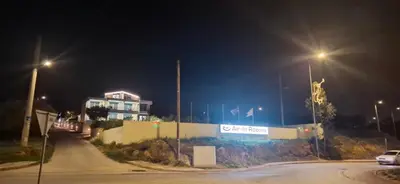 a street at night with street lights and a building at AIR-IN Rooms with magnificent views in Spáta
