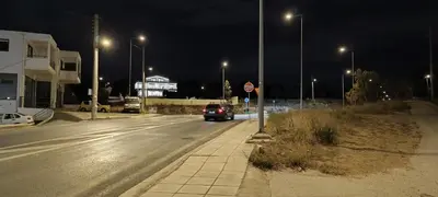 a car driving down a street at night with street lights at AIR-IN Rooms with magnificent views in Spáta