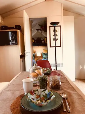 a table with two plates of food on it at Villa Vravrona Tower & Suites in Markopoulo