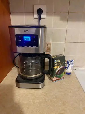 a coffee maker sitting on top of a counter at Οικογενειακό Διαμέρισμα στην Αθήνα in Athens