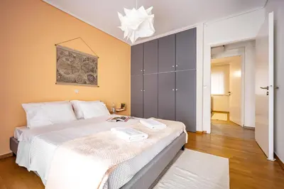 a bedroom with a large white bed in a room at Group&Family Luxury in Athens