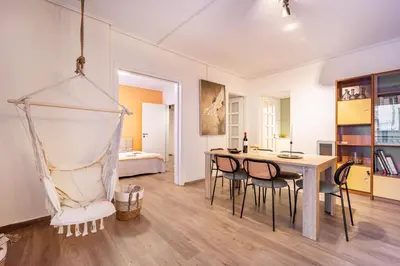 a room with a table and chairs and a bed at Group&Family Luxury in Athens