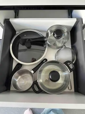 a drawer filled with many pots and pans at Cozy apartment in a new building apartment 5 in Piraeus