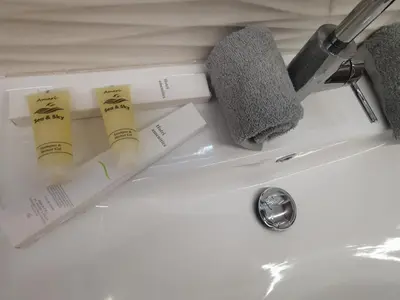 two toothbrushes sitting on top of a bathroom sink at Athens Oasis Apartment in Athens